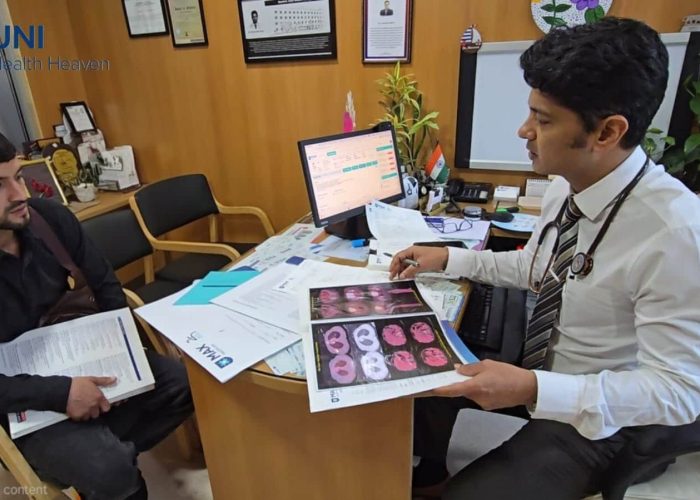Doctor reviewing medical reports and treatment options with an international patient in India