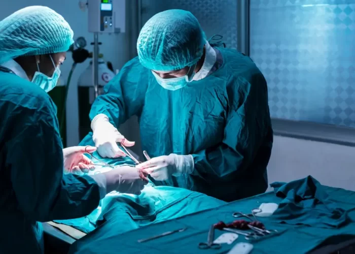 Specialist surgeons performing advanced surgical treatment in a modern operating room